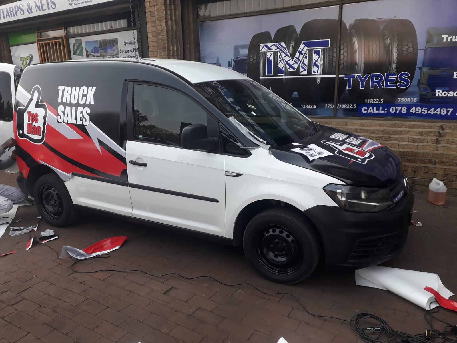 Professional Truck Sales Vehicle Wrap - Red and White Branding Design